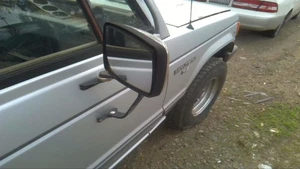 Passenger Side View Mirror Manual Low-mount 2 Mounts Fits 89-91 MONTERO 31248531 - Picture 1 of 9