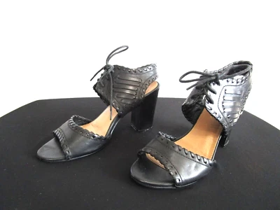 Sandalias de tacón alto con correa en el tobillo de cuero sintético negro restringido para mujer 7 Foto 1 de 4