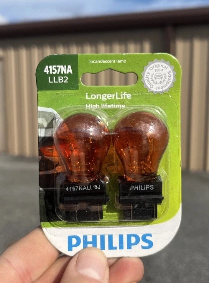 Philips LongerLife 4157NA 28.5/7.5W Dos Bombillas Señal de Giro Frontal Estacionamiento Reemplazar OE Foto 1 de 2