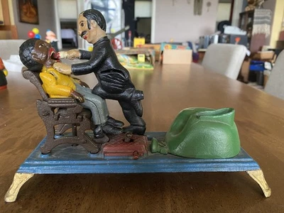 Cast Iron Bank Dentist Pulling Tooth (Book of Knowledge) - Image 1 of 4
