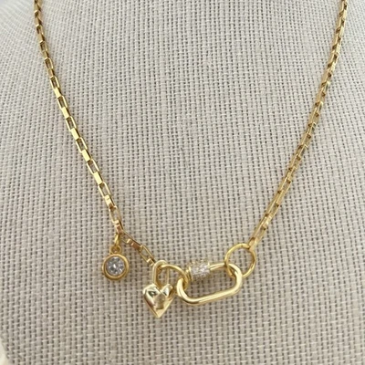 Collar mosquetón corazón bloqueado enchapado en oro de 18 quilates titanio robo joyería para mujer Foto 1 de 4