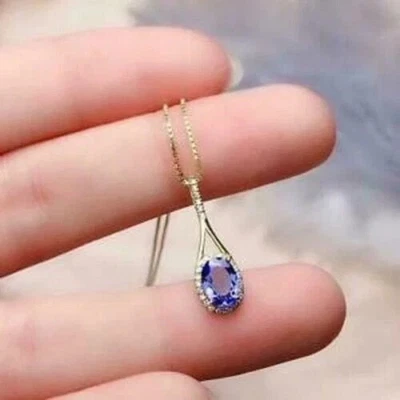 Colgante con halo de tanzanita azul corte ovalado de 2 quilates de oro blanco de 14 quilates sobre plata Foto 1 de 3