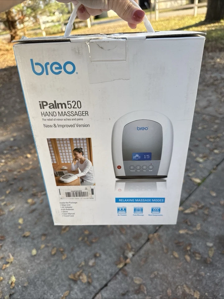 Masajeador de palma eléctrico de mano Breo iPalm 520, blanco/plateado Foto 1 de 1