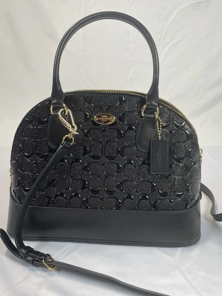 Bolso COACH Debossed Charol CORA Dome Negro, BOLSO DE HOMBRO BIDIRECCIONAL Foto 1 de 4