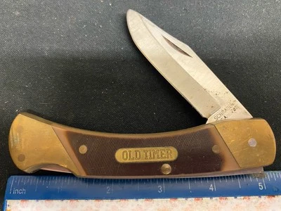Cuchillo Schrade EE. UU. Old Timer 7OT Lockback, asas Delrin marrón cortadas en sierra Foto 1 de 4