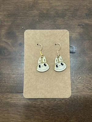 Pendientes colgantes hipoalergénicos marrón tostado cabeza energía monstruo icono de moda Foto 1 de 3