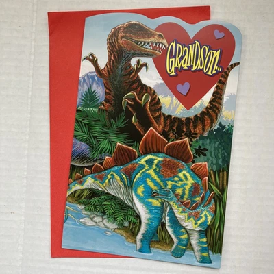 Tarjeta de cumpleaños sin firmar para nieto joven - dinosaurios - sobre Foto 1 de 4