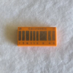 LEGO DELOREAN ORANGE LICENSE PLATE 1x2 TILE from Set 21103 Part# 3069bpb0287 - Picture 1 of 2