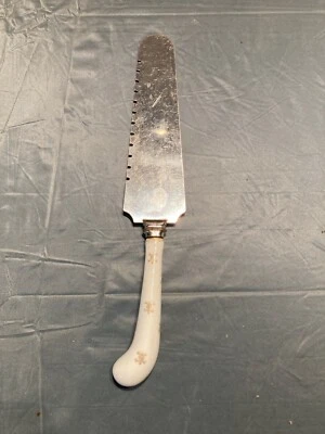 ¿De colección (SHEFFIELD)? Cuchillo de cerámica para servir pasteles de boda Fleur De Lis (INGLATERRA)? Foto 1 de 4