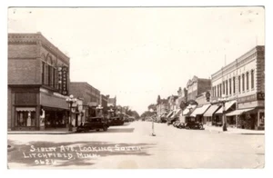 SIBLEY AVE LITCHFIELD MINNESOTA RPPC POSTCARD 1936 CARS SIGNS - Picture 1 of 2