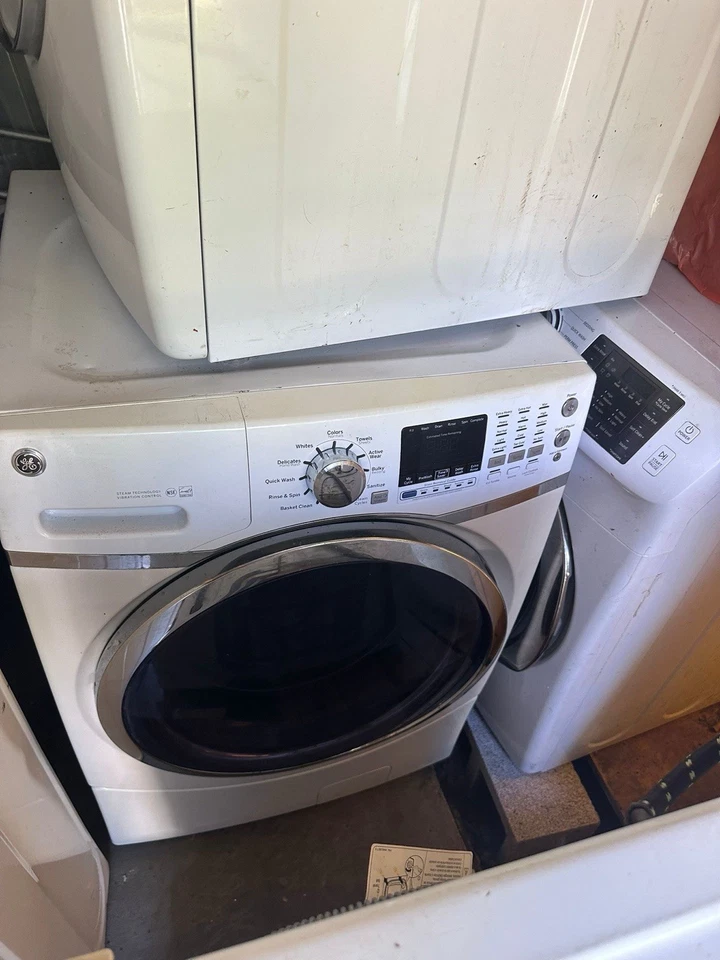 GE Front Load Washing Machine WITH Steam Feature - Image 1 of 4