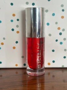 Skinn Cosmetics Divine Elixir Manuka Honig + C Lipgloss-Öl purpurrot 0,17 Oz. - Bild 1 von 4