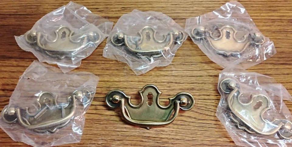 Lot of 6 Brass Tone Keyhole Batwing Style 4"w Drawer Pulls 3"in. center & Screws - Image 1 of 4
