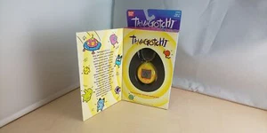 Bandai Original TamaGotchi Yellow & Orange, 1996 - 1997 English - Picture 1 of 11