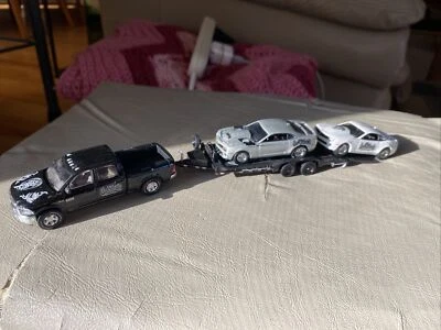 Camión Greenlight Gas Monkey Garage Ram 1500 y 2 coches 1:64 (4 piezas en total) Foto 1 de 4