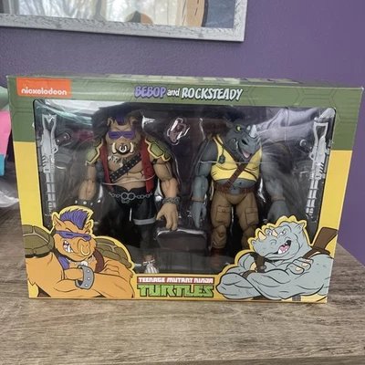 Paquete de 2 figuras de acción NECA TMNT Teenage Mutant Ninja Turtles Bebop y Rocksteady Foto 1 de 4