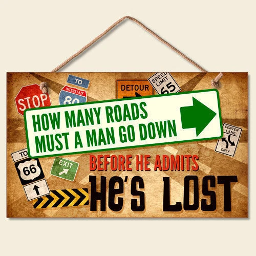 Letrero retro de madera placa de pared cuántas carreteras debe bajar un hombre admite que ha perdido Foto 1 de 1