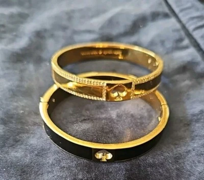 *2* Pulseras con bisagras Kate Spade. Negro y dorado Foto 1 de 4