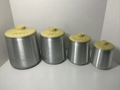 Juego de 4 botes de aluminio vintage Kromex tapas amarillas botes de cocina anidados Foto 1 de 4