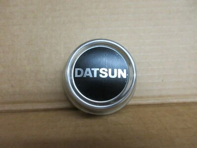 Adorno de tapacubos central vintage NOS Datsun 40342-W2200 Foto 1 de 4