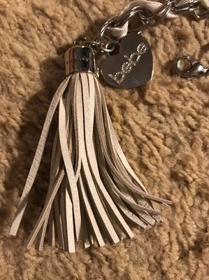 BEBE CINTURÓN SATINADO CON CORDONES PLATEADO CON BORLA DE CUERO Foto 1 de 4