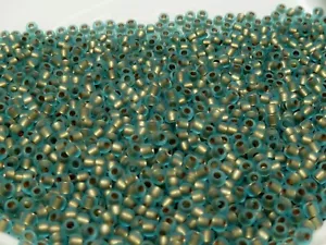 Toho Seed Beads 11/0 - Frosted Gold Lined Aqua - Picture 1 of 1