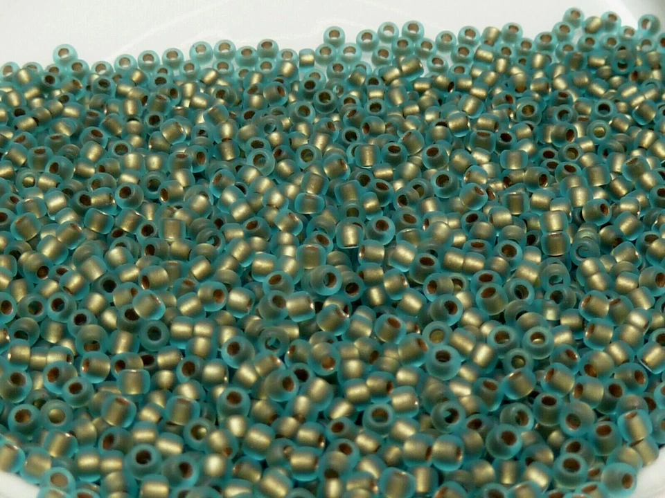 Toho Seed Beads 11/0 - Frosted Gold Lined Aqua - Image 1 of 1