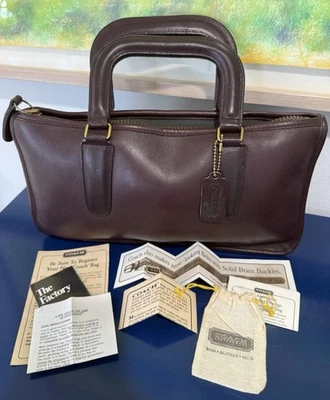 Bolso Cartera Coach Vintage Delgado Borgoña Cashin Papeleo Etiqueta Colgante Nueva York Como Nuevo Foto 1 de 4