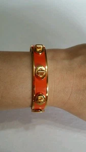 COACH TURNLOCK HINGE BANGLE BRACELET, GOLD AND ORANGE $118 + TAX - Picture 1 of 12