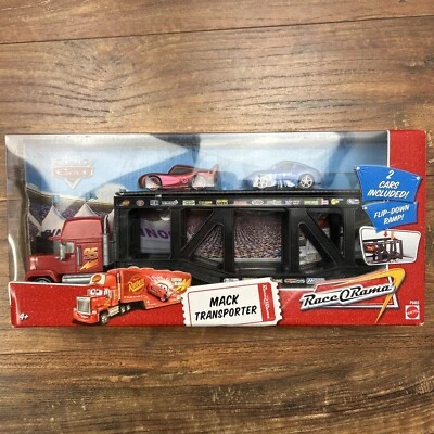DISNEY PIXAR THE WORLD OF CARS. MACK TRANSPORTER  RACE-O-RAMA RARE!!! New in Box - Image 1 of 4