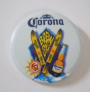 Corona Beer Brew Ski Pinback 2.5" Round Button Skiing Advertising Campaign - Picture 1 of 2
