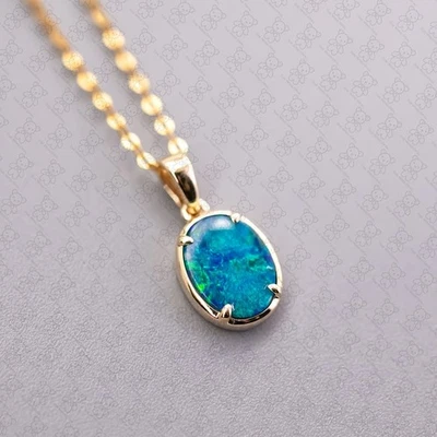 Collar colgante mínimo ovalado australiano doblete ópalo oro amarillo 14k Foto 1 de 4