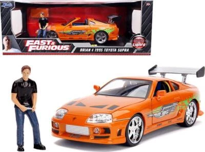 1995 Toyota Supra Orange Metallic w/ Lights & Brian Figure Fast and Furious 1:18 - Image 1 of 2