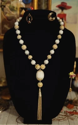 Tassel necklace. White marbled-pattern beads and Ornate Goldtone Metalwork  - Image 1 of 4