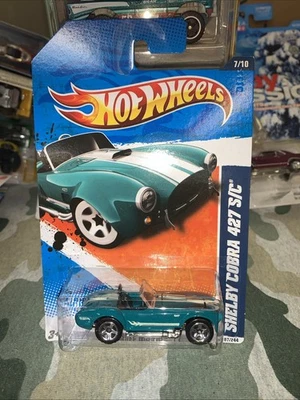 2011 Hot Wheels Shelby Cobra 427 S/C Muscle Mania 107/244 azul-petróleo novo lacrado - Imagem 1 de 4