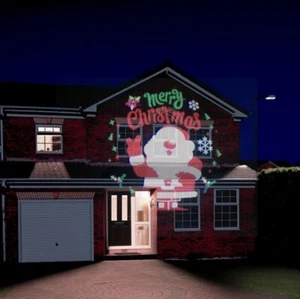 Proyector de foco festivo muñeco de nieve Feliz Navidad Santa para uso en interiores/exteriores - Imagen 1 de 3