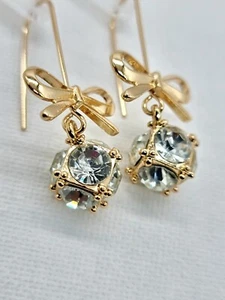 Long Dangle Earrings White Crystal Gold Tone Bow Glam Occasion Gift - Picture 1 of 9