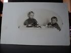 2 Cute Kids At Table 1 Praying, 1 Eating Early 1900'S Rppc Postcard
