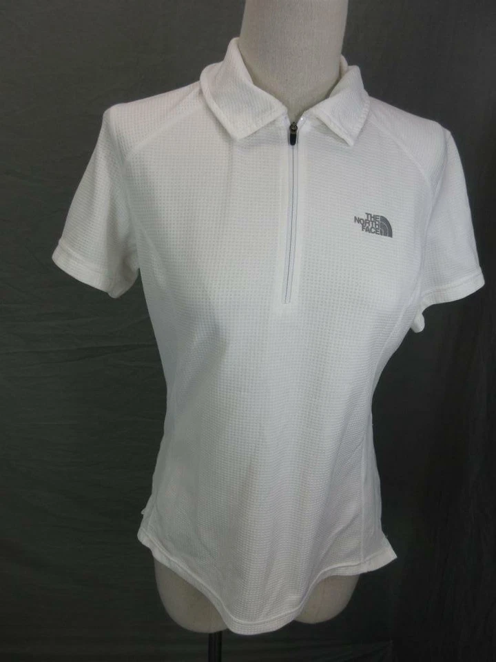 CAMISA POLO ATLÉTICA MUJER THE NORTH FACE BLANCA MANGA CORTA 1/2 CREMALLERA T584 Foto 1 de 4