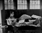 053 RUDOLPH VALENTINO LOUNGING ON SOFA READING A BOOK PHOTO