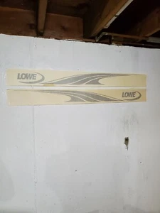 1 SET OF OMC,LOWE BOAT TRAILER DECALS 42" X 4 3/4", VINYLE, CHAMPAGNE COLOR. - Picture 1 of 2