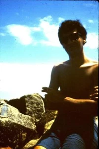 35mm Colour Slide- Man smoking on rocks at the beach - Picture 1 of 1