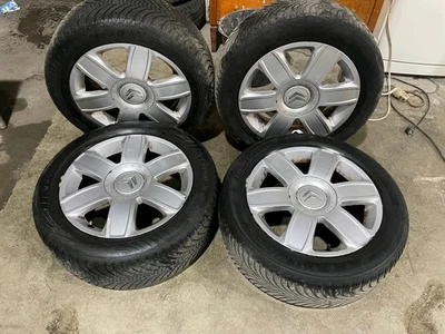 4 Winterreifen 205 55 R16 16" inkl. Opel Stahlfelgen mit Radkappen - Bild 1 von 4