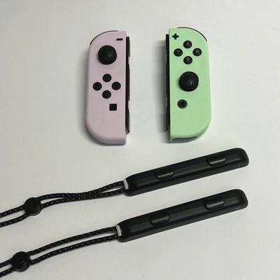 JoyCon Nintendo Switch Lilla e Verde Originali | Completi con Cinturini Polso - Immagine 1 di 4