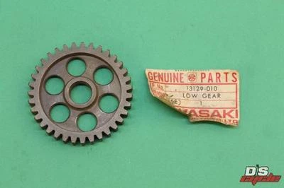 NOS KAWASAKI KD100 KE100 KH100 KM100 EJE DE SALIDA PIEZA DE MARCHA BAJA # 13129-010 Foto 1 de 4