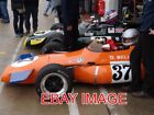 PHOTO  TWO F2 BRABHAMS THE DARK GREEN CAR OF DAVID BROWN AND THE ORANGE CAR OF L