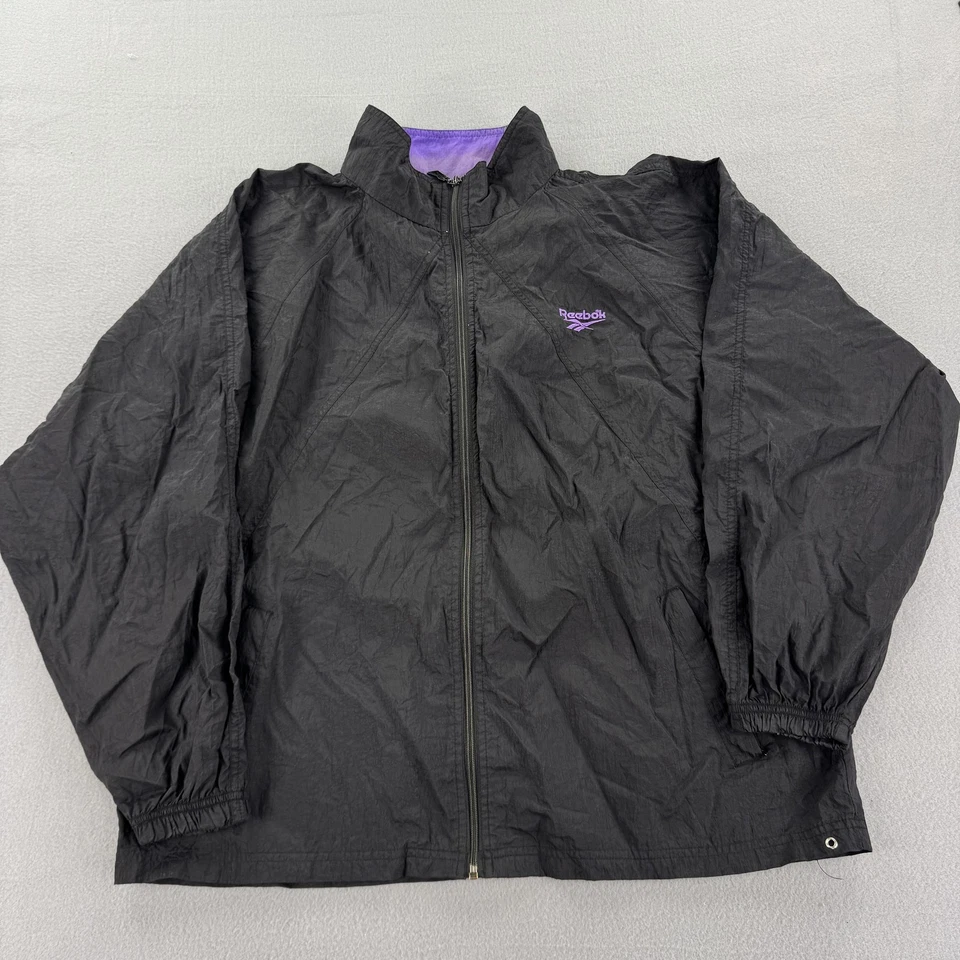 Chaqueta cortavientos vintage Reebok para hombre XL negra púrpura nailon cremallera completa años 90 retro Foto 1 de 4
