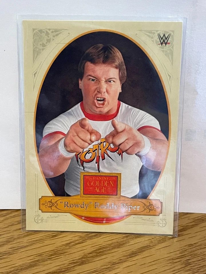 “Rowdy” Roddy Piper 2023 Panini Chronicles Golden Age WWE No. 177 - Image 1 of 2