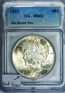 1922 Peace Dollar ICG MS-62; Obverse Struck Thru Mint Error - Picture 1 of 6
