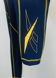Leggings da allenamento da donna blu/oro Reebok Speedwick taglia 1X (16 W) in perfette condizioni - Foto 1 di 3
